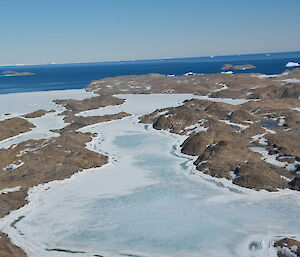 Aerial view of small islands with ice in between instead of water