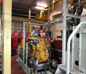 Tradesperson tending to a diesel generator