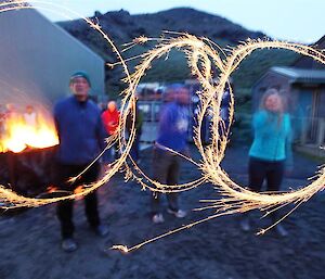 Expeditioners waving sparklers around