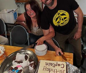 Nancye and Pete K with their respective birthday cakes