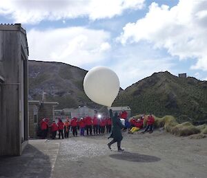 Visitors at the Station watch the launch of the weather balloon