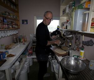 Pete P cooks up a storm in Hurd Point hut.