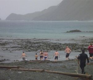 Swimmers enter the water on the east side, for the second dip.