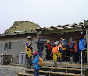 Visitors arrive at the station Mess and take of their shoes before entering