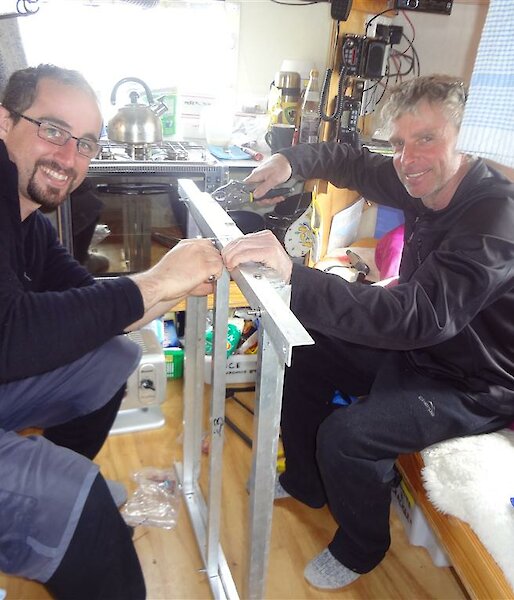Dan and Tony assembling the frames in Windy Ridge hut