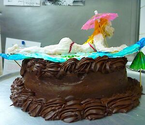 A surfing beauty — cake with surfer on top made by Belinda