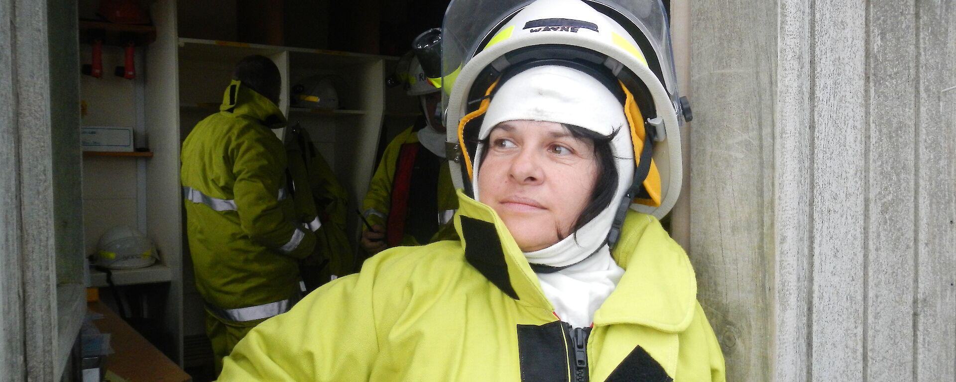 Maria dressed in fire fighting uniform