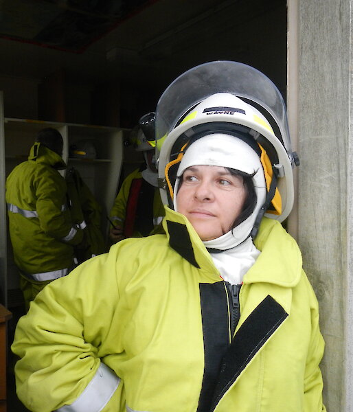 Maria dressed in fire fighting uniform