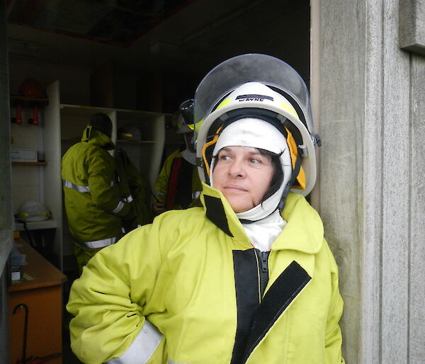 Maria dressed in fire fighting uniform