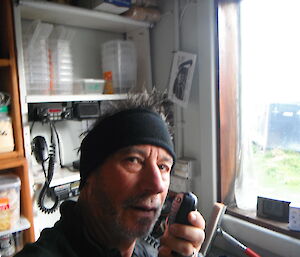 Gary communicating with station via hand radio