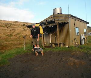 Dave and Tamar the dog outside of a small structure on Macquarie Island