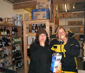 Maria and Narelle sprung eating chips in Fort Knox