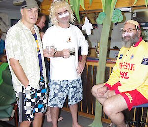 Mango, Stu and Ray pose by a ‘palm tree'