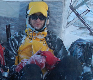 Richard, covered in frost, trying to keep warm on Mt Eitel
