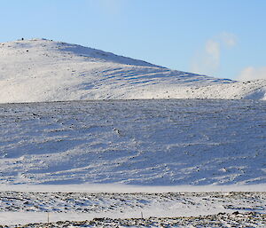 The last hill, covered in snow, for Narelle and Maria to traverse on Macquarie Island