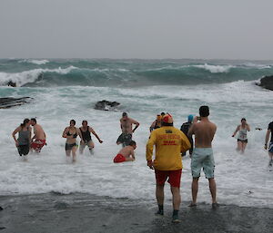 Swimmers leave the water at Macquarie Island 2012 midwinter swim