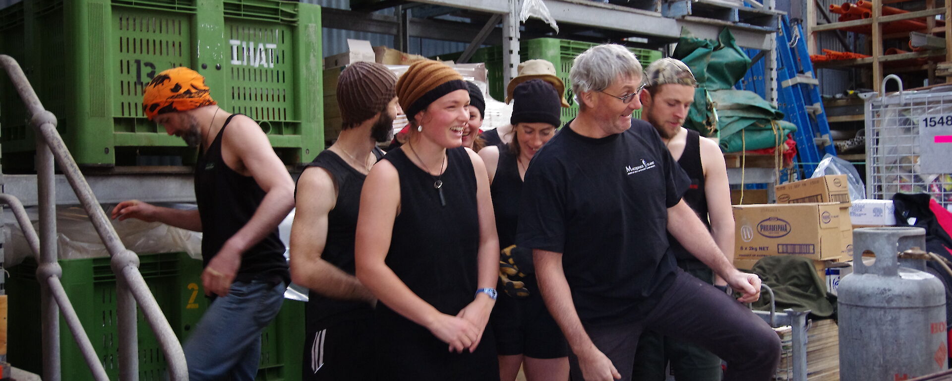 Kiwi expeditioners dressed in black weigh-in for the tug of war