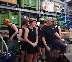Kiwi expeditioners dressed in black weigh-in for the tug of war