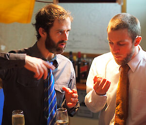 Stephen and Cameron having a discussion during Midwinter dinner