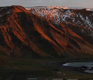 Orange sunset light bathes the Plateau – photo taken from the Golf Tee on the hill behind station