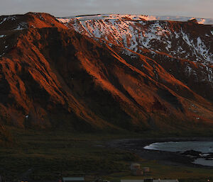 Orange sunset light bathes the Plateau — photo taken from the Golf Tee on the hill behind station