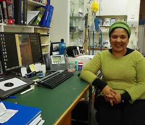 Dr Mel sits at her desk in the surgery waiting for patients