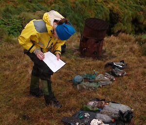 Expeditioner picking up rubbish on the beach