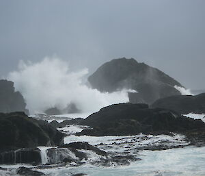 waves crashing over rocks