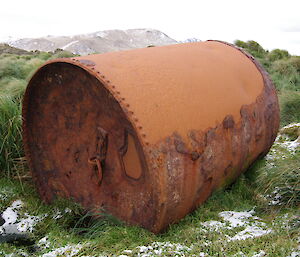Large rusty boiler outside in grass at Bauer Bay