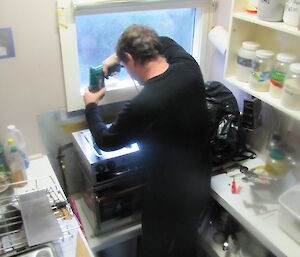 Tom replacing the stove at Hurd Point