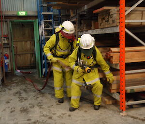 Two expeditioners with fire fighting gear on