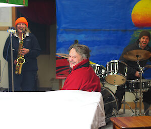 Expeditioners playing the saxaphone and drums