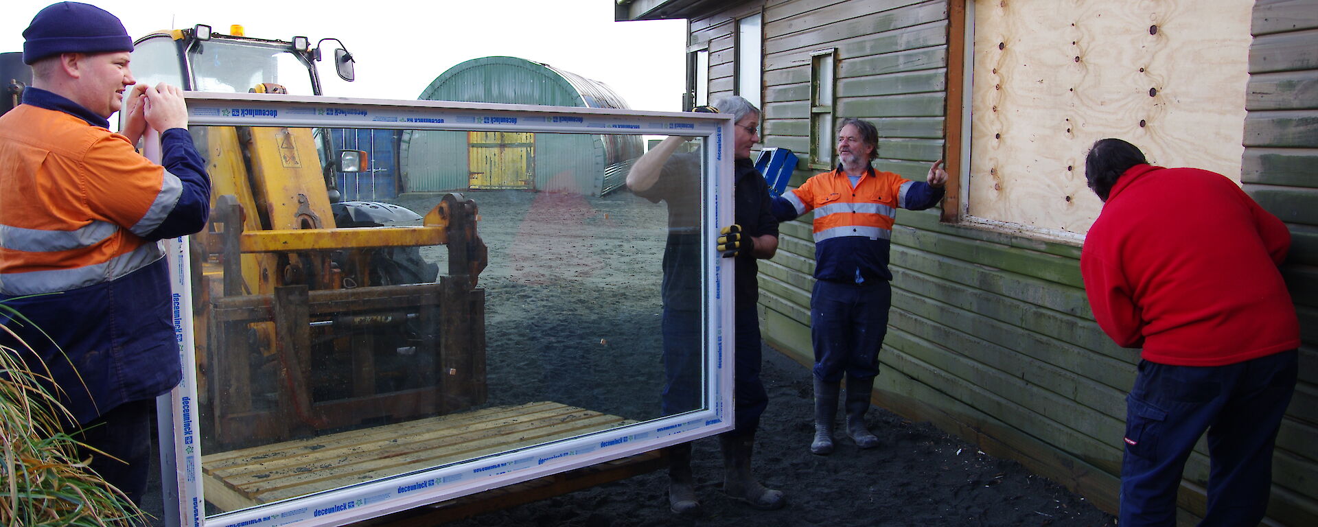 Matt, Dave, Jim and Ray installing the new window