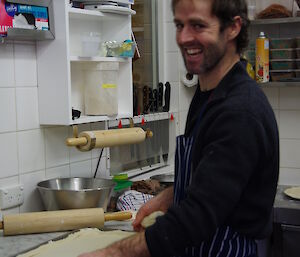 Stephen assisting Cam in making pizzas