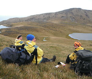 Karen, Lauren and Pete taking a break on grassy hill
