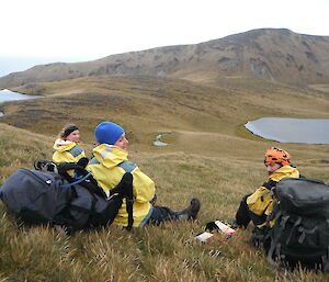 Karen, Lauren and Pete taking a break on grassy hill