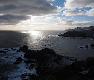Cascaded Points, sun shining onto water from behind dark clouds