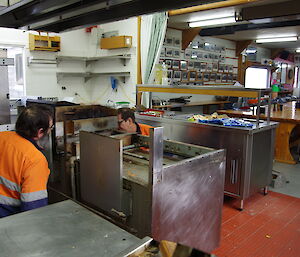 Ray and Tom removing kitchen appliances