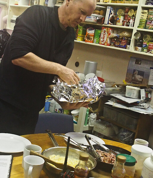 Dave at Hurd Point cooking breakfast
