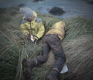 Karen and Richard lying in long grass