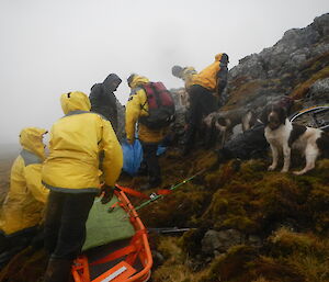 The team preparing the stretcher