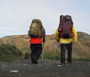 Bauer Bay here we come — two expeditioners in full gear with backpacks facing camera