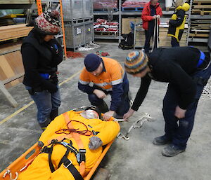 Maria, Matt and Andrew attending to the patient