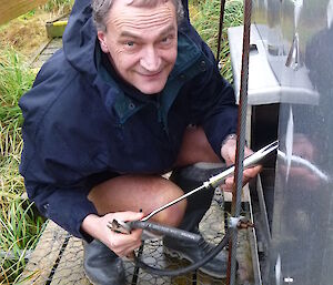 Mango fixing the generator at Waterfall Bay