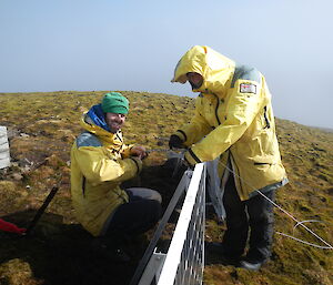 Stephen and Garry assisting aligning solar panels