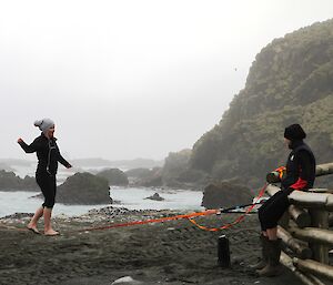 Karen tightrope walking, Jane looking on