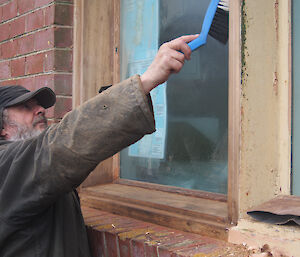 Jim stripping back the window on the science building