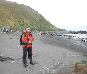 Cameron on beach with penguins