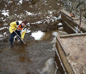 Tom cleaning out the dam