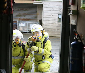 Jim and Tom entering a building during firefighting training
